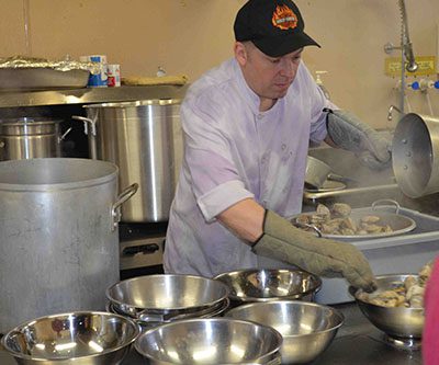 Chef Mark prepping clams for delivery